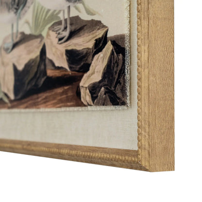 Close-up of a framed painting with a wooden frame and textured mat.