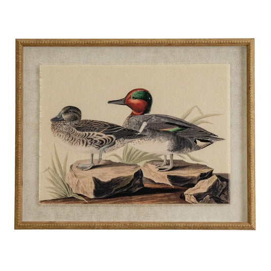 Framed artwork of two ducks on rocks with a beige background
