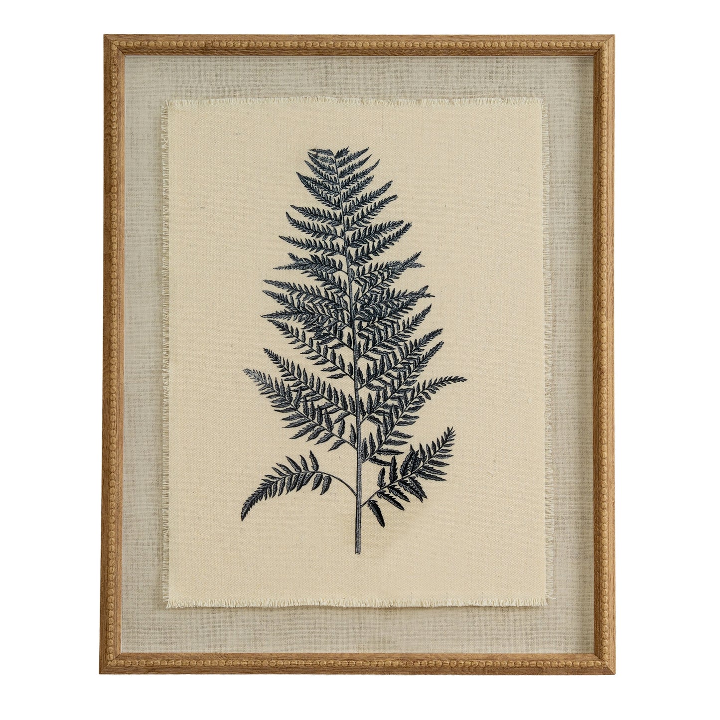 Framed artwork of a black fern leaf on beige fabric background
