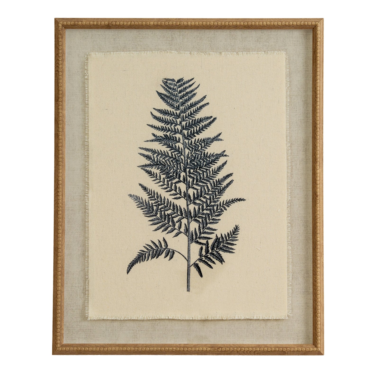 Framed artwork of a black fern leaf on beige fabric background
