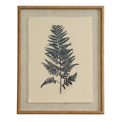 Framed artwork of a black fern leaf on beige fabric background