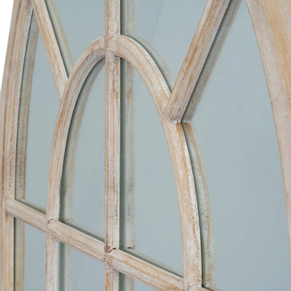 Wooden window frame with glass panes against a light blue background