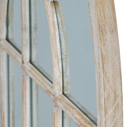 Close-up of a wooden mirror with geometric design on a light background