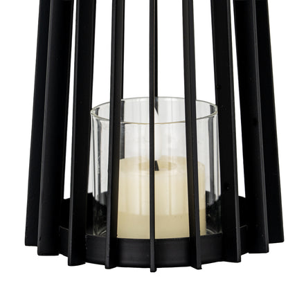 Black metal lantern with a candle inside on a white background
