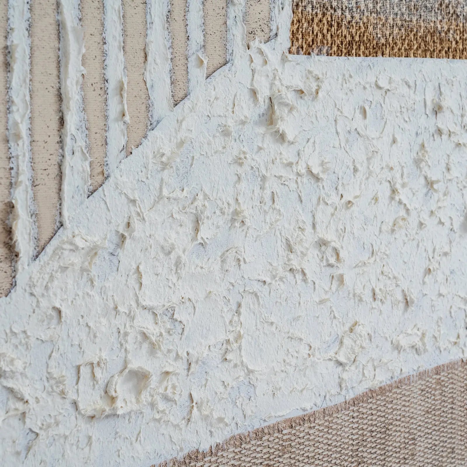 Textured surface with a mix of white, beige, and brown colors