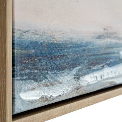 Close-up of a framed abstract painting with blue and white brushstrokes.