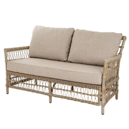 Wicker outdoor sofa with beige cushions on a white background