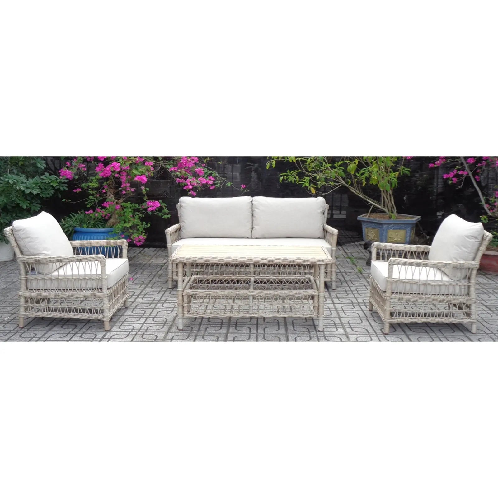 Outdoor furniture set with wicker chairs and sofa on a patio