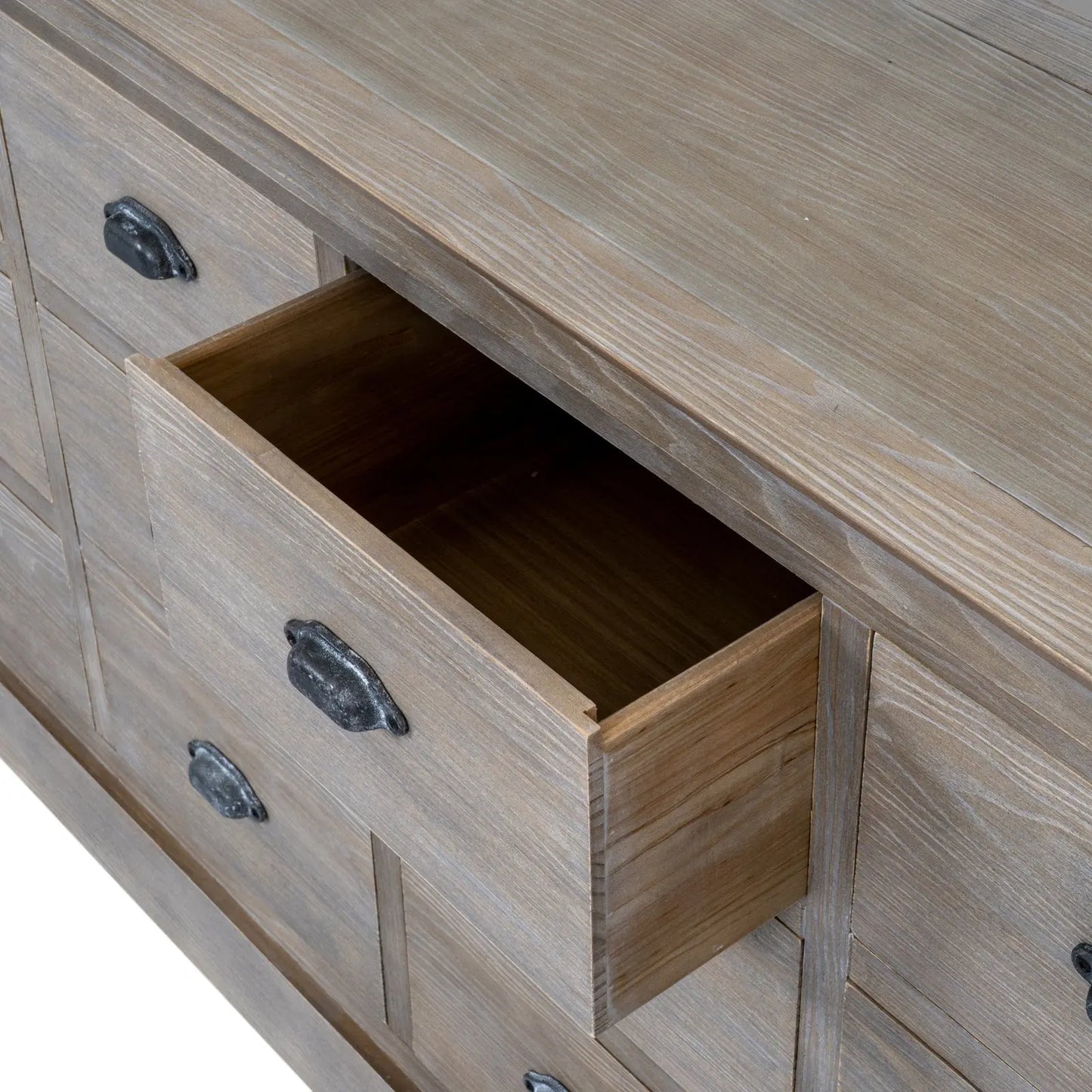Wooden drawer with metal handles on a wooden cabinet