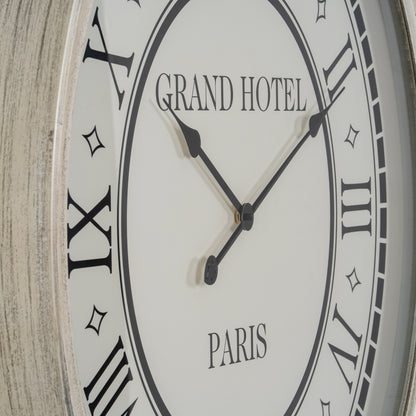 Wall clock with 'Grand Hotel Paris' text on a wooden background