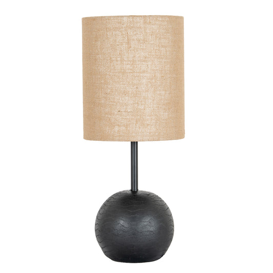 Table lamp with a textured beige shade and dark base on a white background