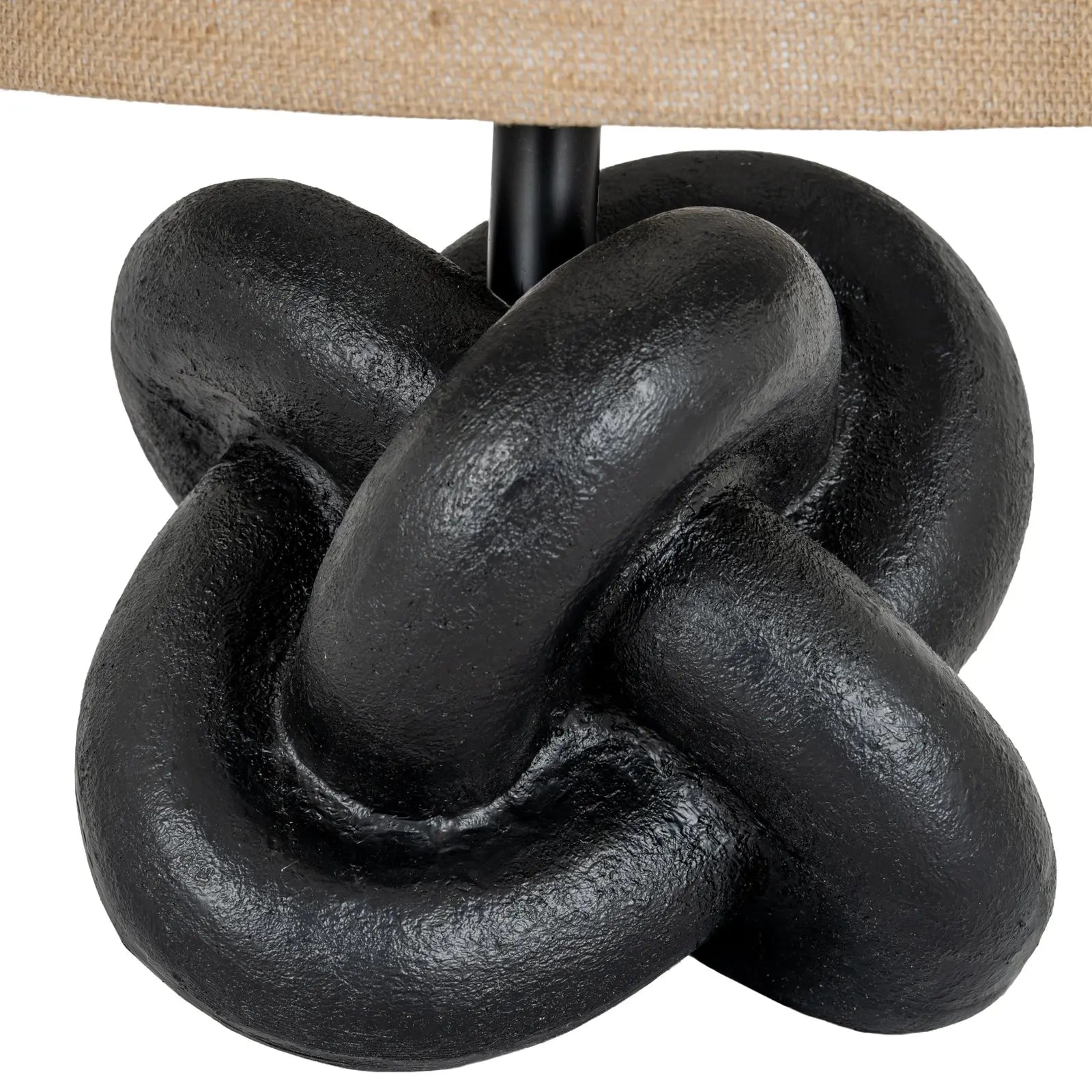 Decorative black knot design on a white background