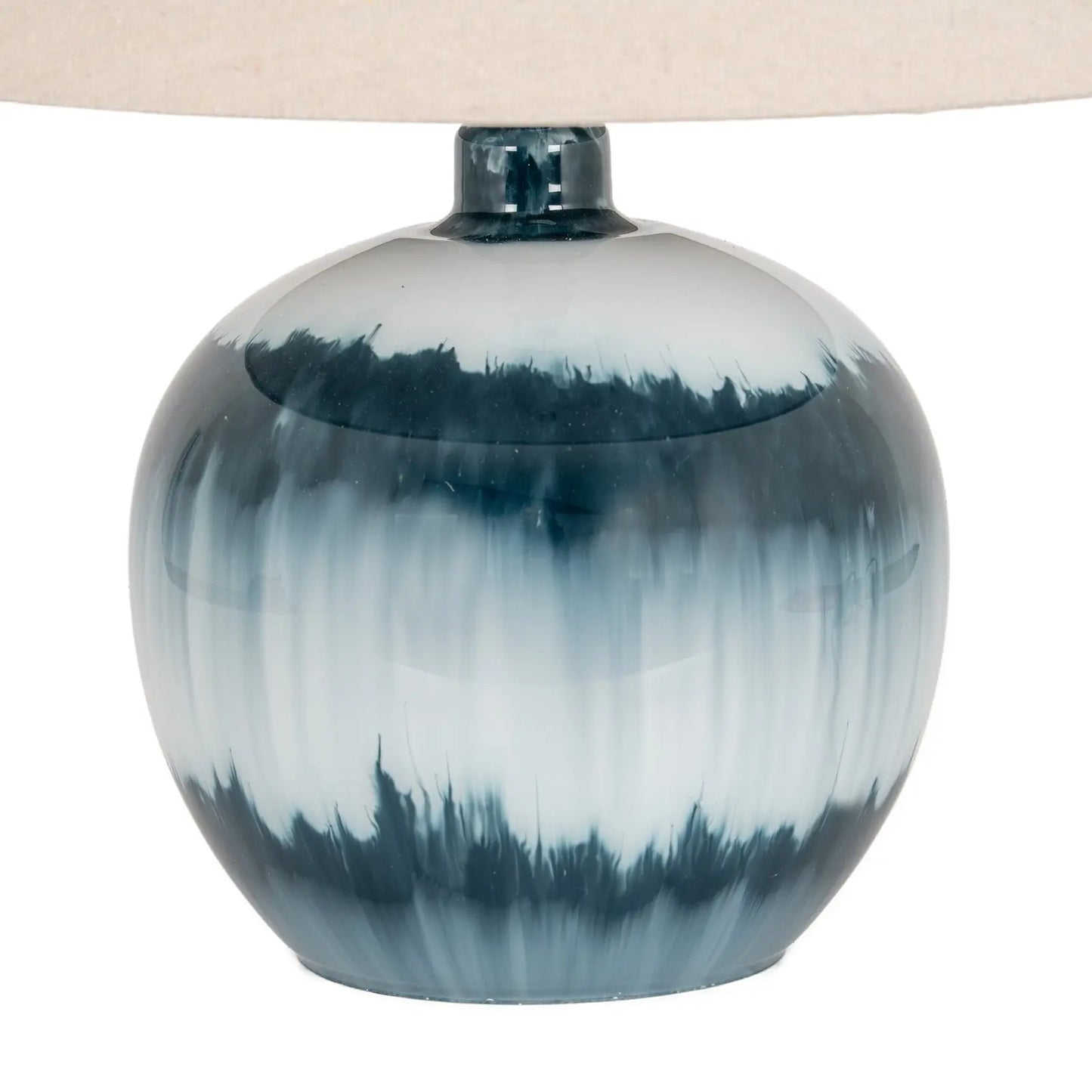 Table lamp with a blue and white ceramic base on a white background