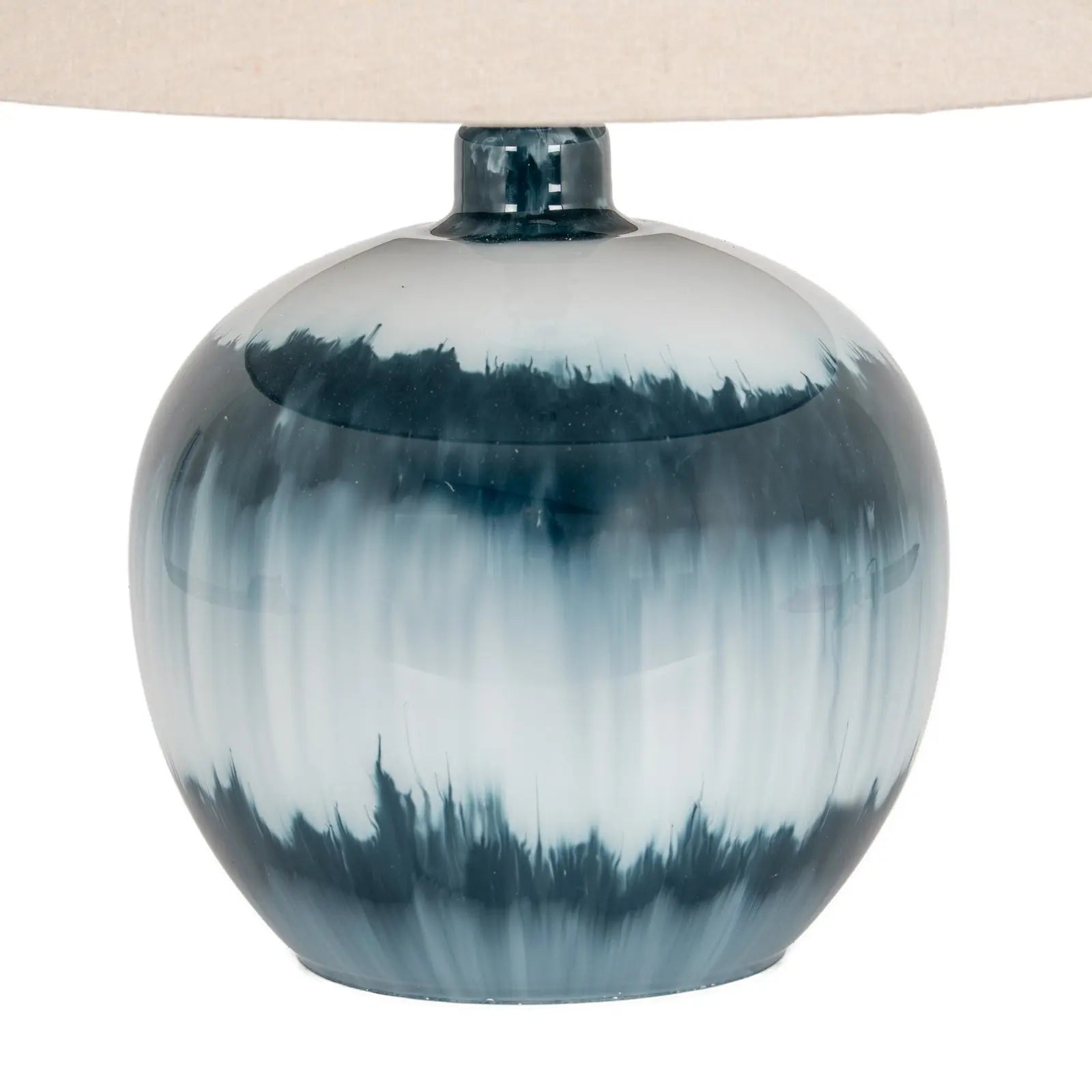Table lamp with a blue and white ceramic base on a white background