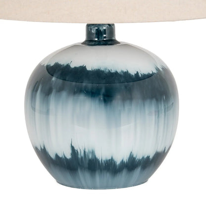 Table lamp with a blue and white ceramic base on a white background