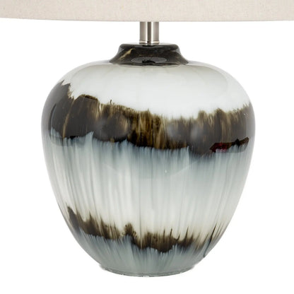 Decorative lamp with a white and brown ceramic base on a white background
