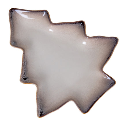 Star-shaped ceramic dish with a textured edge on a white background