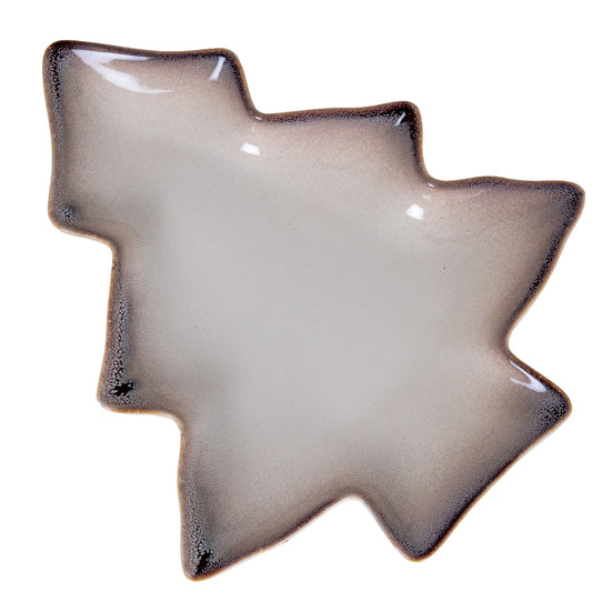 Star-shaped ceramic dish with a textured edge on a white background