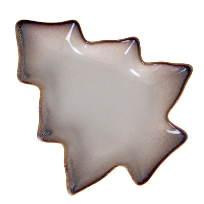 Decorative ceramic leaf-shaped plate on a white background