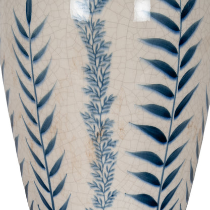 Ceramic vase with blue leaf patterns on a textured beige background