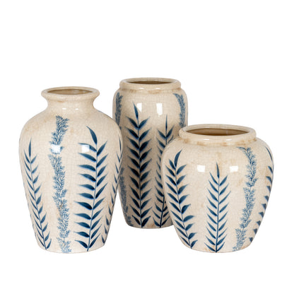 Three ceramic vases with blue leaf patterns on a white background
