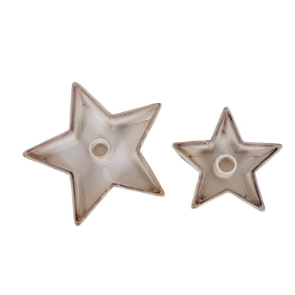 Two star-shaped ceramic holders on a white background