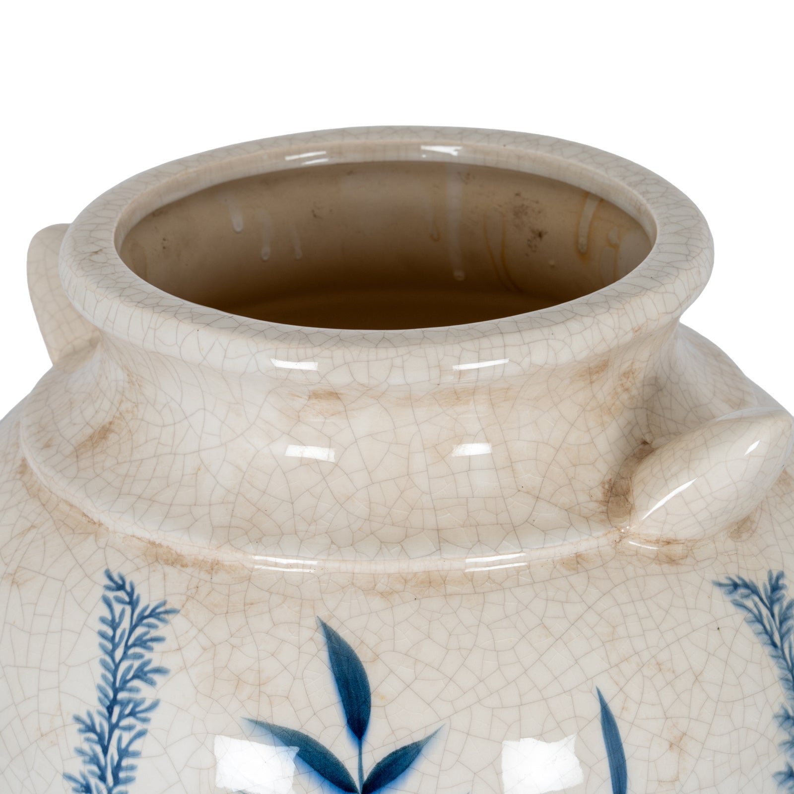 Close-up of a ceramic jar with blue floral patterns on a white background