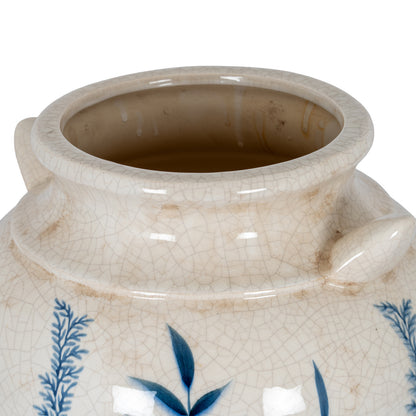 Close-up of a ceramic jar with blue floral patterns on a white background