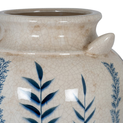 Ceramic jar with blue leaf patterns on a white background