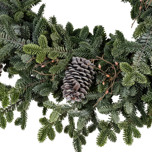 Artificial Christmas garland with pine cones on a white background