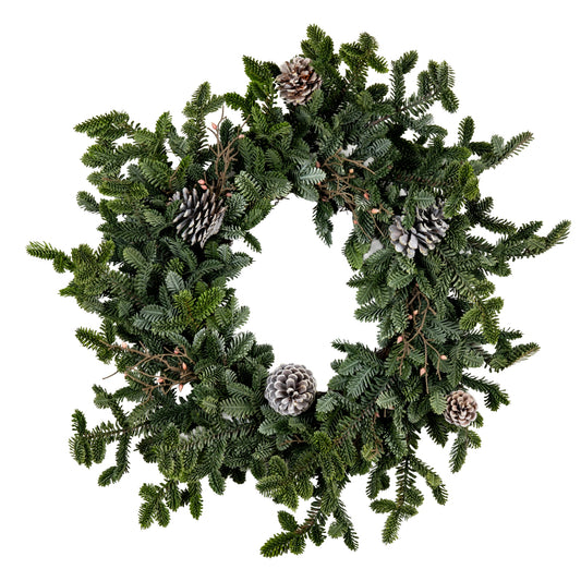 Green Christmas wreath with pine cones on a white background