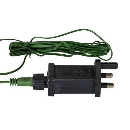 Black electrical plug with green wiring on a white background