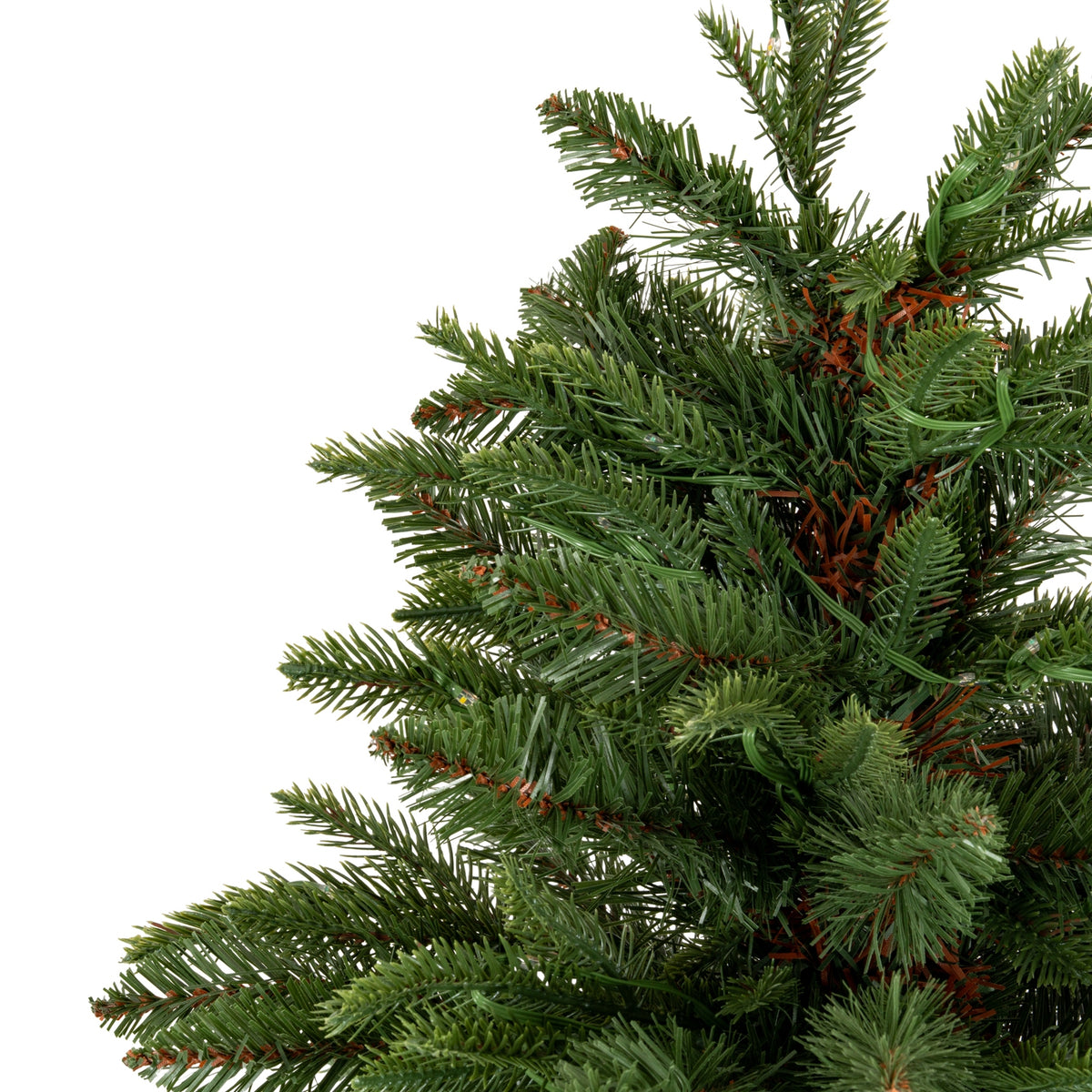 Close-up of a green artificial Christmas tree with brown accents on a white background