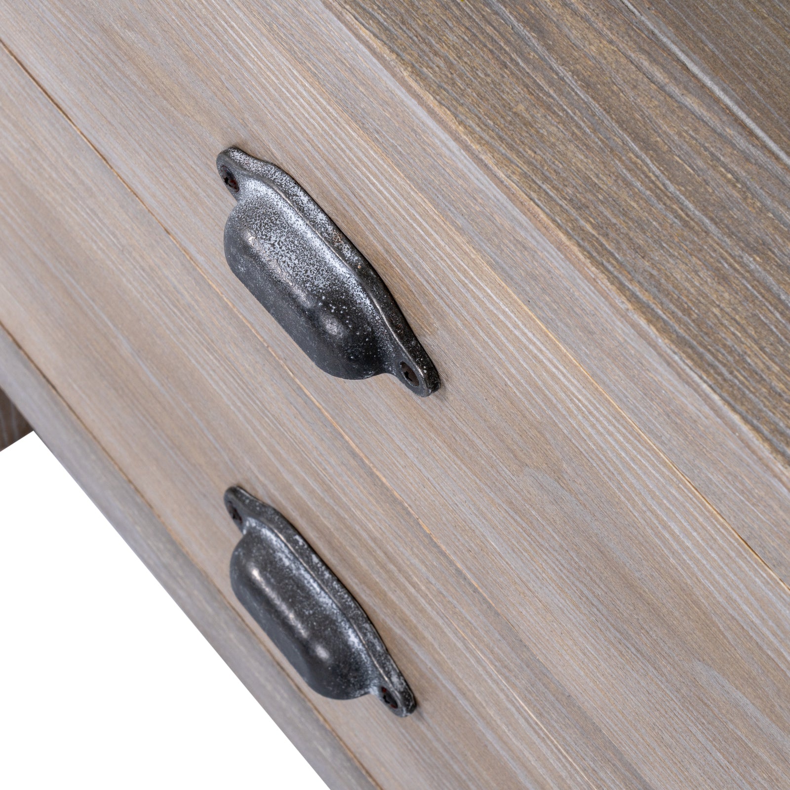 Close-up of wooden drawer with metal handles on a light wood background