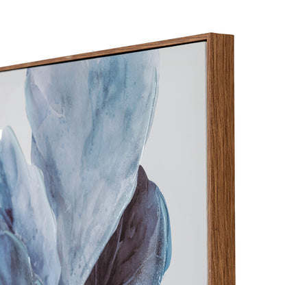 Close-up of a framed abstract wall art print showing a blue and gray watercolor-style design with a medium brown wood frame on a white background.