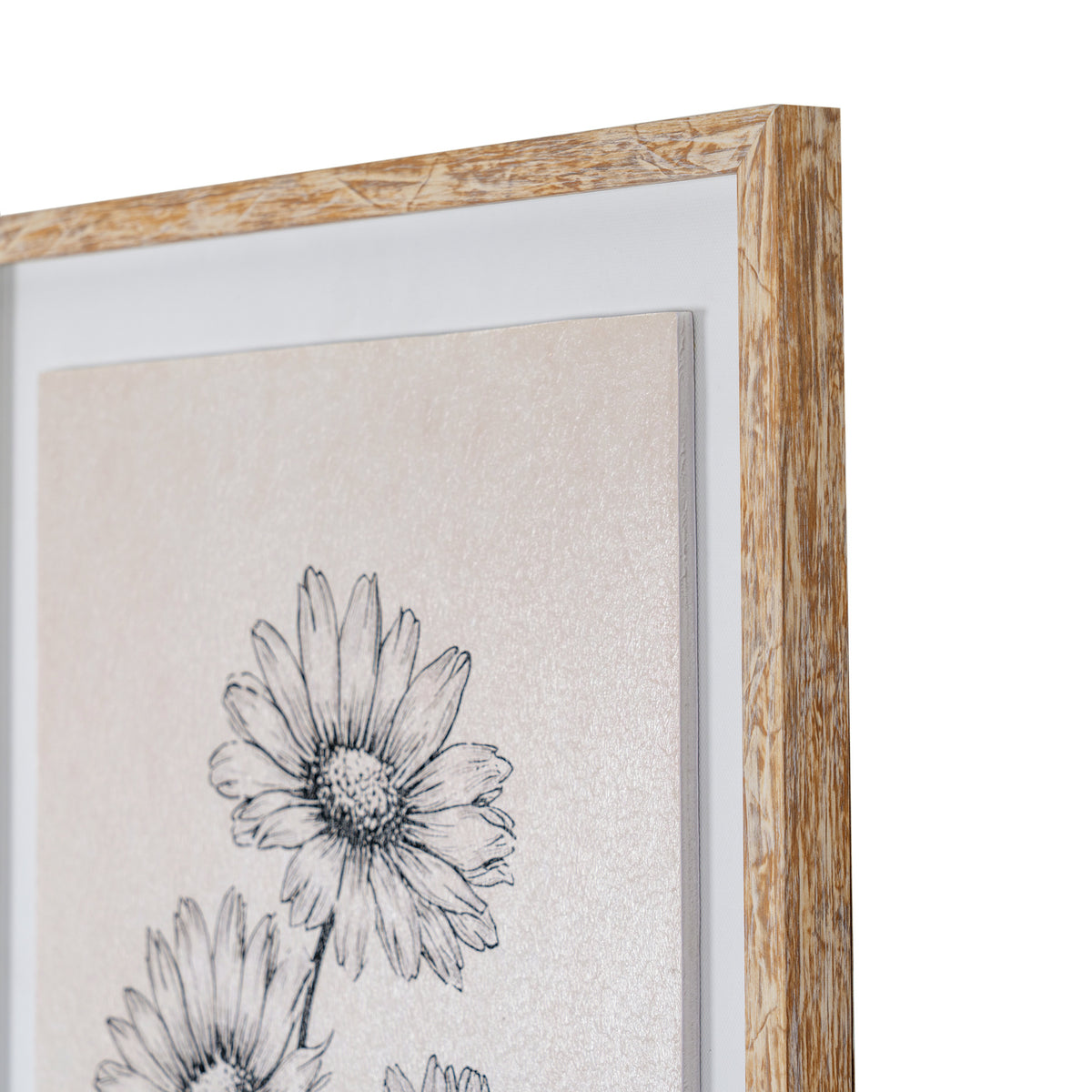 Close-up of a framed floral art print showing a black line drawing of daisy-like flowers on a textured warm beige background, with a white mat and a natural wood frame.