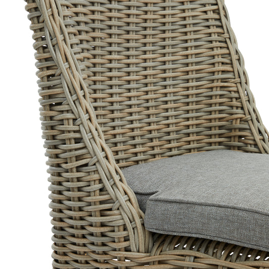 Wicker chair with a gray cushion on a white background