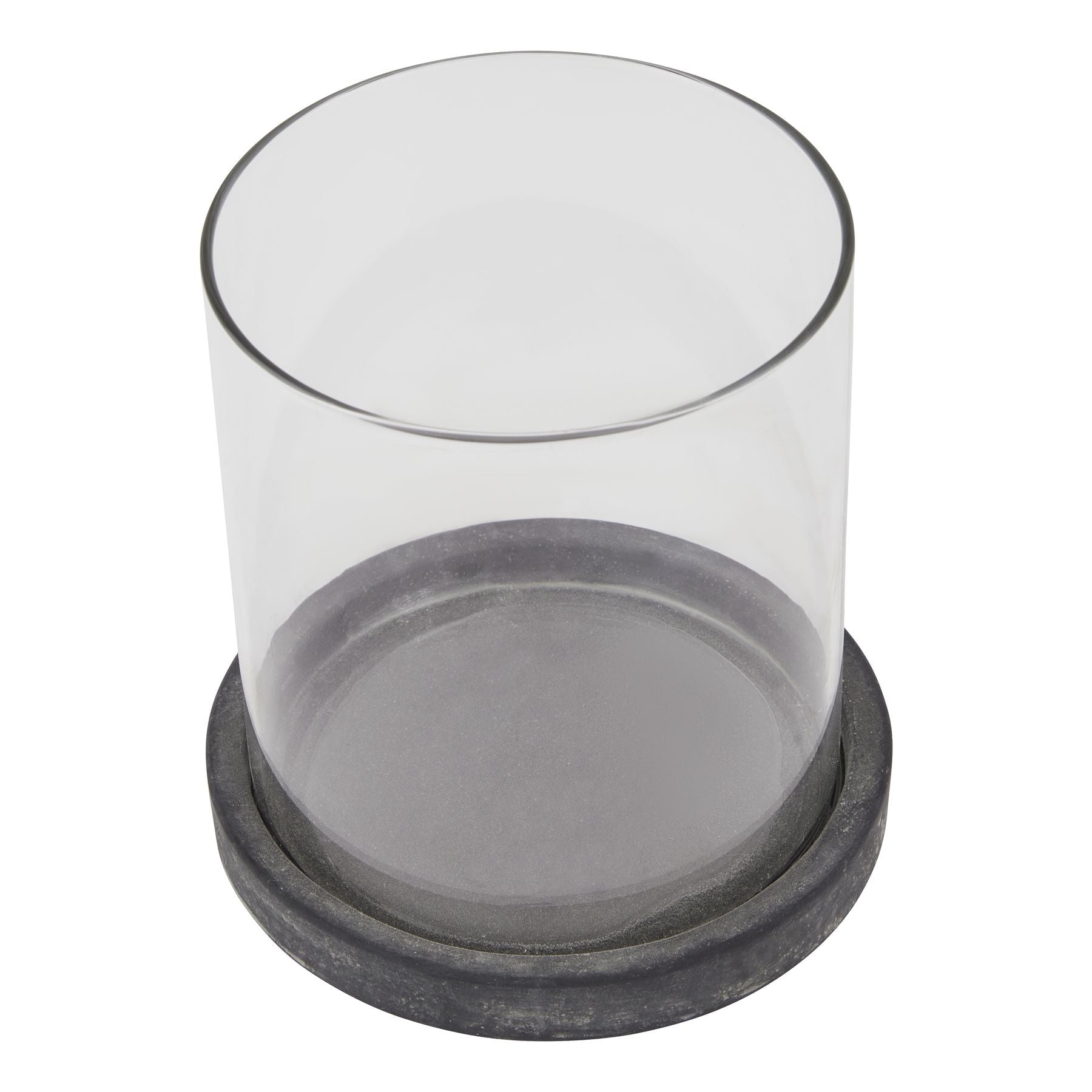Clear glass container with a black rubber base on a white background