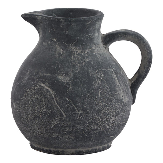 Black ceramic pitcher with handle on a white background