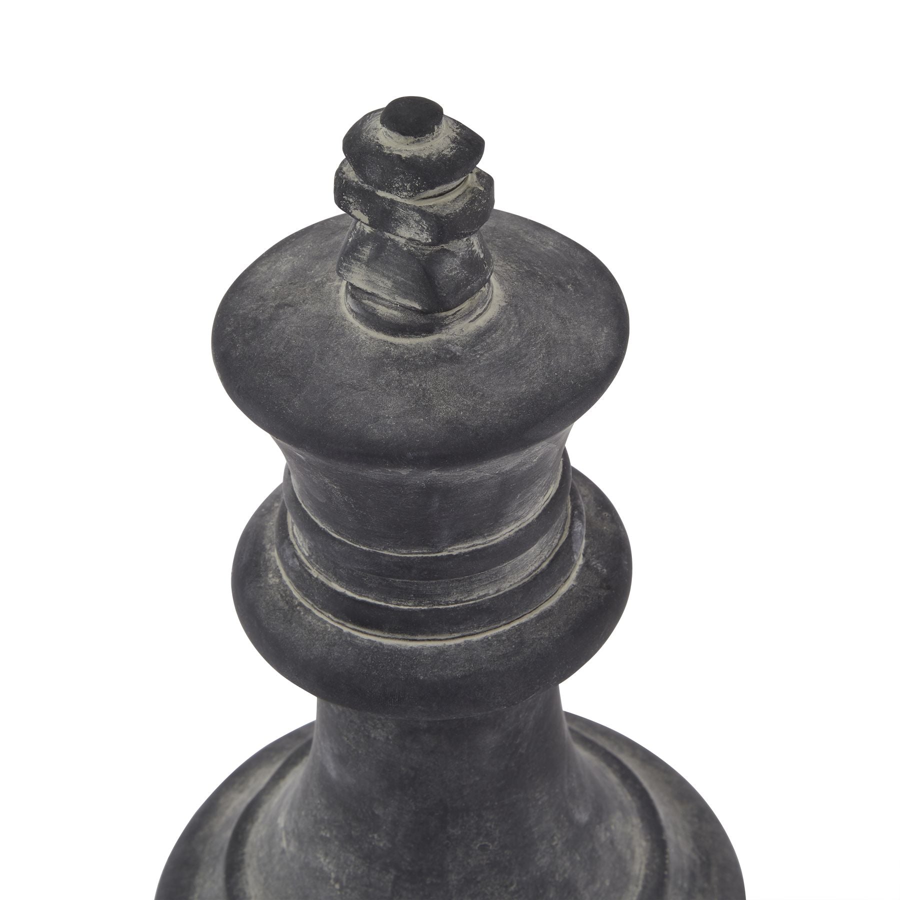 Black chess piece, likely a king, on a white background