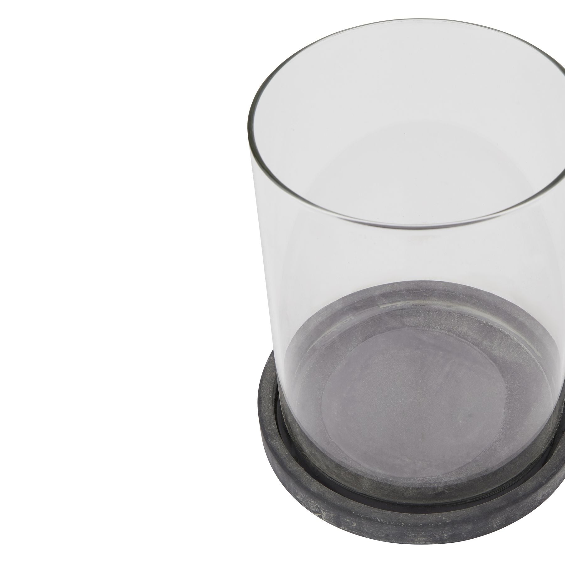 Clear glass container with black base on a white background