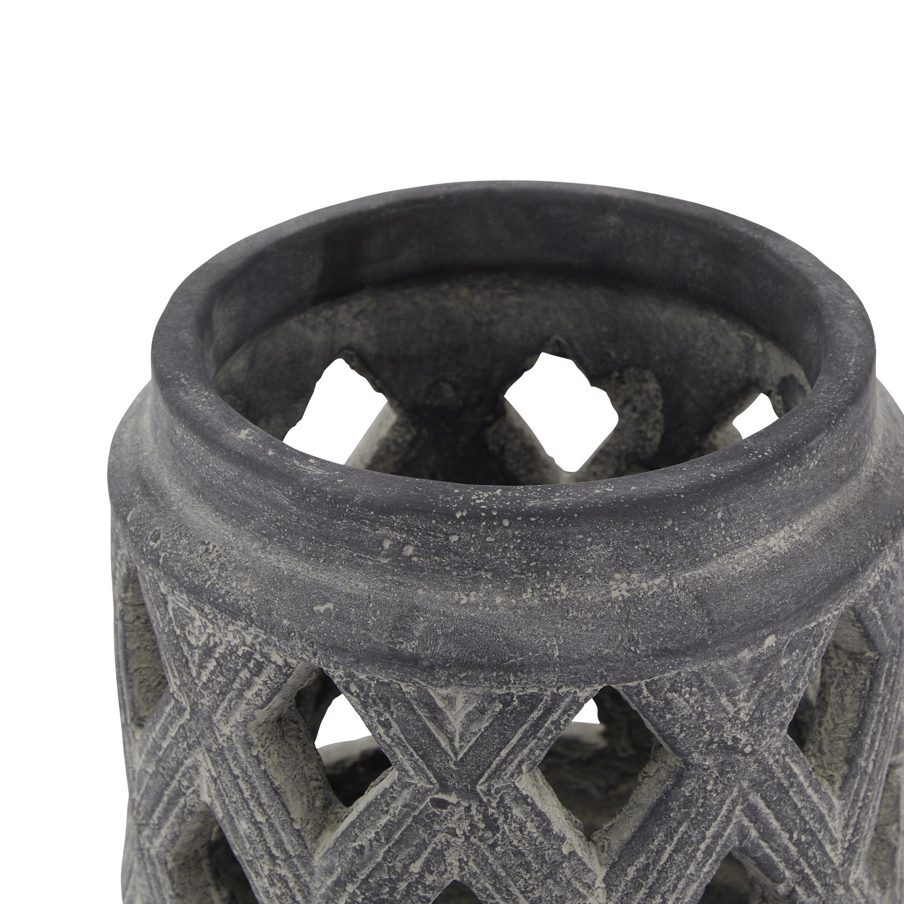 Close-up of a textured black ceramic vase on a white background