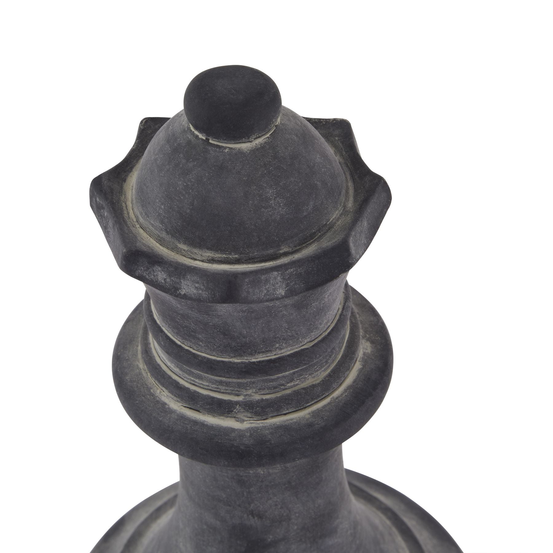 Decorative black metal finial on a white background