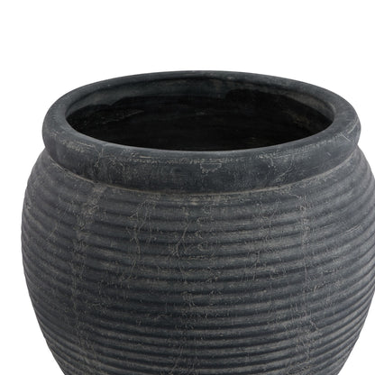 Black textured pot on a white background