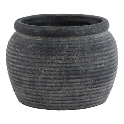 Textured black pot on a white background