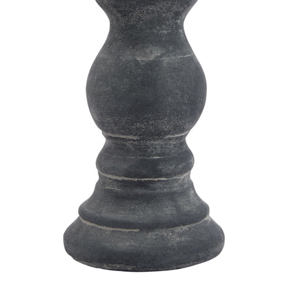 Dark gray stone pedestal on a white background