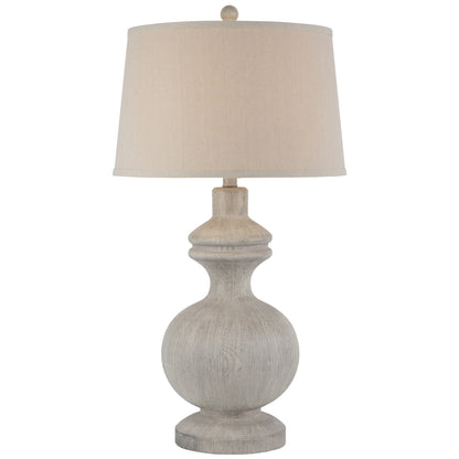 Table lamp with beige shade and textured base on a white background