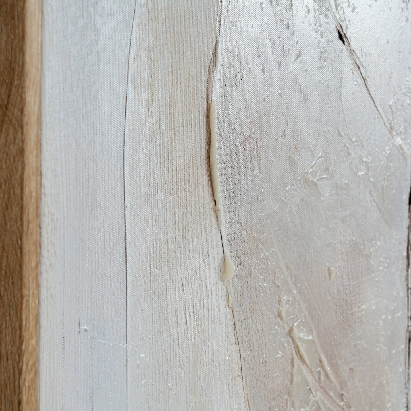 Close-up of a textured surface with a wooden edge