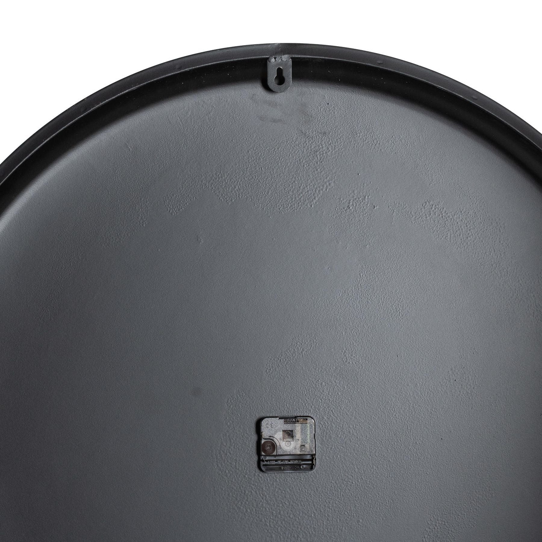 Close-up of a gray metal surface with a small rectangular component on a white background