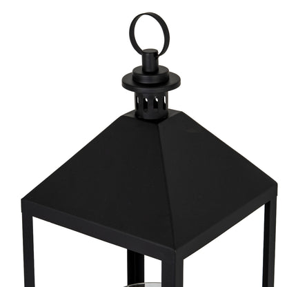 Black metal lantern on a white background